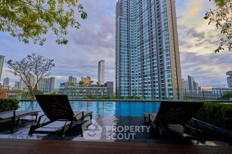 Luxurious high-rise condo with stunning pool and city skyline view
