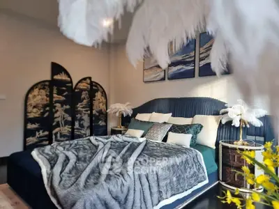 Luxurious bedroom with elegant decor and plush bedding