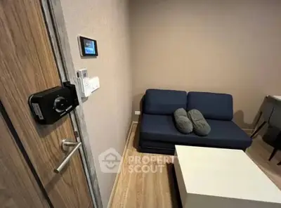 Modern living room with smart lock and cozy sofa in stylish apartment.