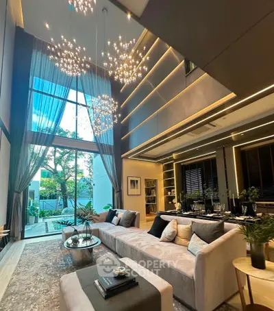 Luxurious modern living room with high ceilings and elegant lighting