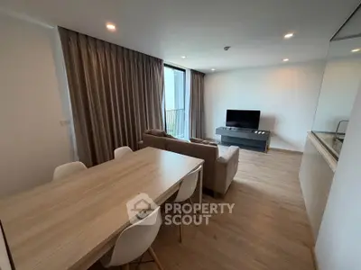 Modern living room with sleek furniture and natural light, perfect for relaxation and entertainment.