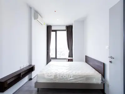 Modern minimalist bedroom with large window and air conditioning