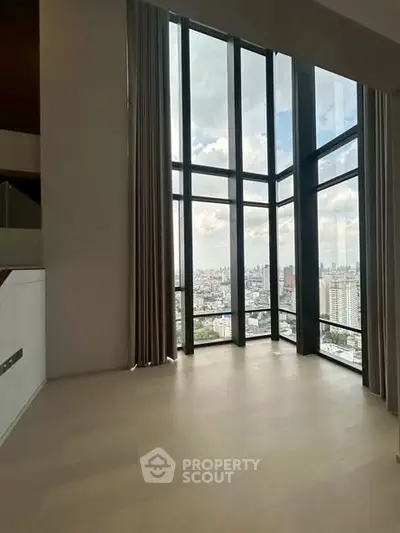 Spacious corner unit with floor-to-ceiling windows offering stunning city views.