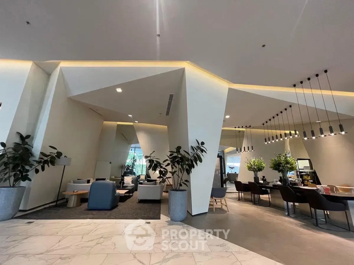 Modern lobby with stylish seating and contemporary lighting in luxury building