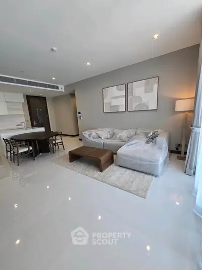 Spacious modern living room with open kitchen and elegant decor