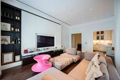 Luxurious living room with modern decor and open kitchen layout