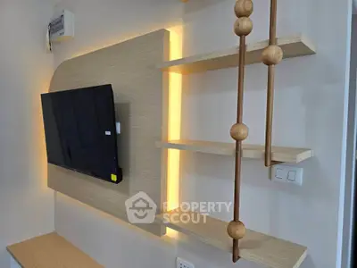 Modern living room with stylish TV wall mount and decorative shelves