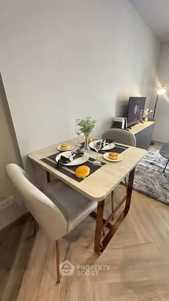 Modern dining area with elegant table setting and cozy ambiance