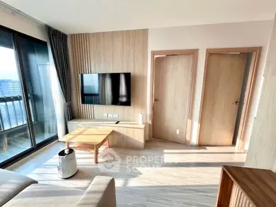 Modern living room with sleek design, large windows, and natural light.