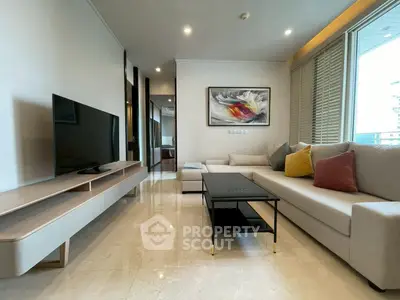 Modern living room with sleek furniture and stylish decor in a luxury apartment.