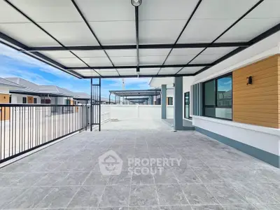 Spacious modern balcony with sleek design and ample natural light, perfect for relaxation and entertainment.