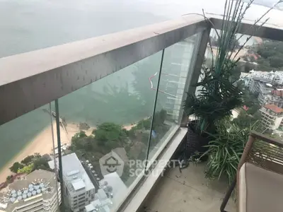 Stunning high-rise balcony with breathtaking ocean view, perfect for relaxation and enjoying the scenery.