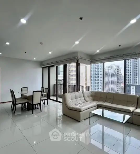 Spacious modern living room with city view and elegant dining area
