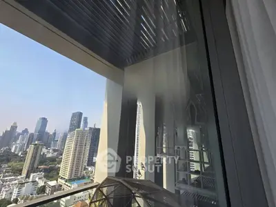 Stunning city view from a high-rise balcony with modern architecture.