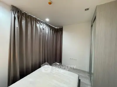 Cozy bedroom with modern curtains and sleek wardrobe design