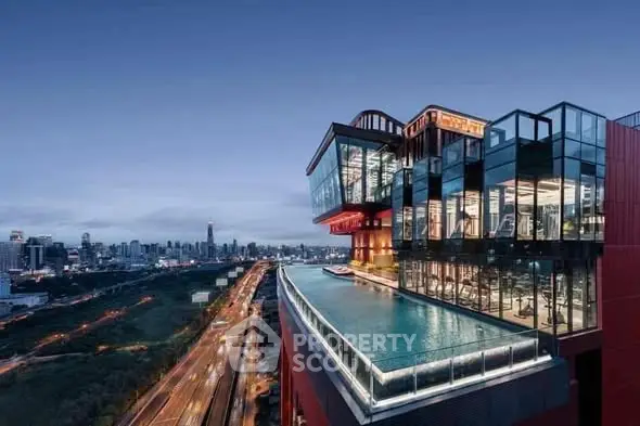Stunning rooftop pool with panoramic city views in modern high-rise building.