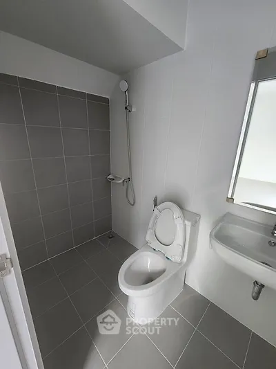 Modern bathroom with sleek tiles and contemporary fixtures