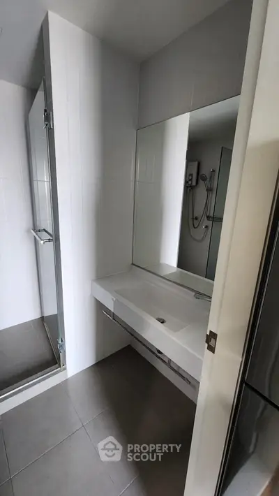 Modern bathroom with sleek design and large mirror