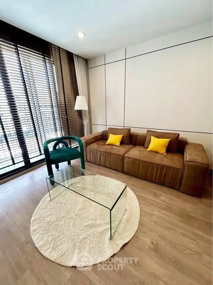 Stylish living room with modern decor and large windows