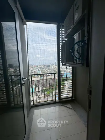 High-rise balcony with cityscape view and air conditioning unit, perfect for urban living.