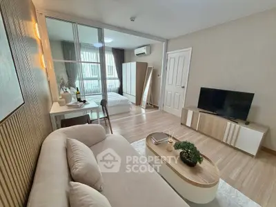 Modern living room with cozy sofa and stylish decor in open-plan apartment