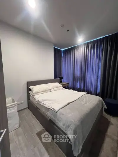 Modern bedroom with cozy lighting and elegant curtains