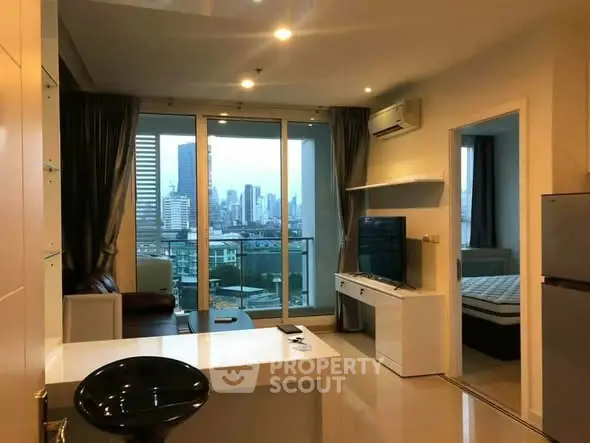 Modern living room with city view, open layout, and sleek furnishings in a high-rise apartment.