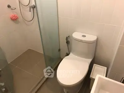 Modern bathroom with glass shower and sleek toilet design