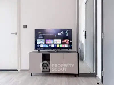 Modern living room with sleek TV setup and stylish cabinet