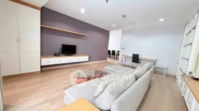 Spacious modern living room with sleek furniture and open layout, perfect for relaxation and entertainment.