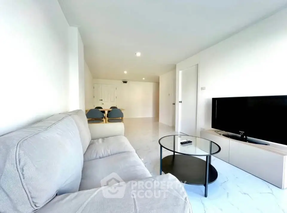 Spacious modern living room with sleek furniture and natural light