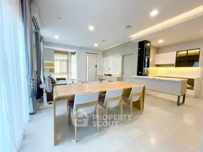 Spacious modern living room with open kitchen and elegant dining area