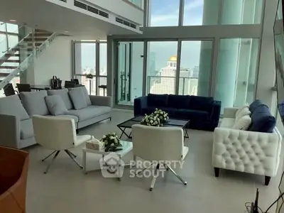 Luxurious modern living room with panoramic city views and elegant furnishings.