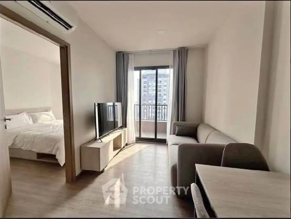 Modern apartment living room with balcony and bedroom view