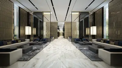 Luxurious modern lobby with elegant seating and marble flooring in a high-end building.