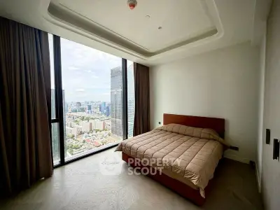 Luxurious bedroom with stunning city view in high-rise apartment