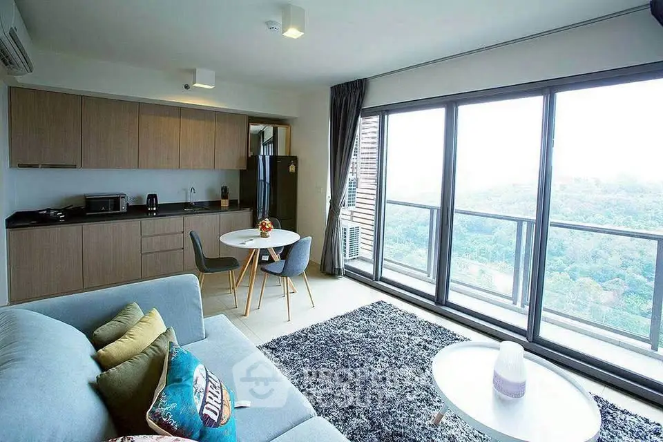 Modern living room with open kitchen and stunning view from large windows