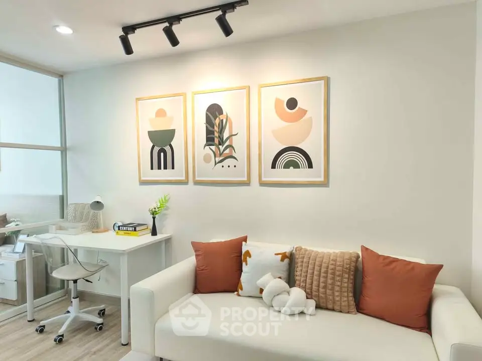 Modern living room with stylish decor and cozy seating area, perfect for relaxation and productivity.