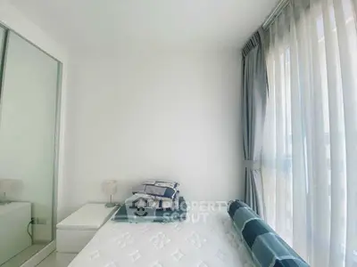 Bright and cozy bedroom with large window and modern decor