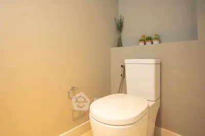 Modern bathroom with sleek toilet and minimalist decor