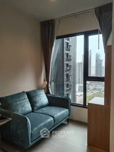 Modern living room with stylish sofa and city view from large window