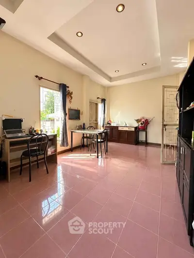 Spacious open-layout room with ample natural light and modern furnishings.