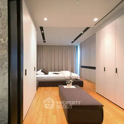 Modern bedroom with sleek design and ample storage space