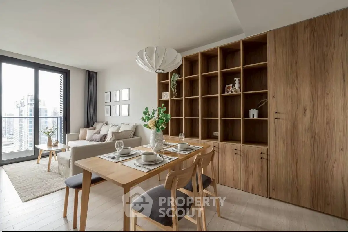 Modern living room with dining area and large windows offering city views