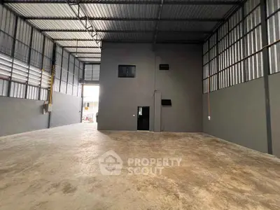 Spacious industrial warehouse with high ceilings and large open floor plan.