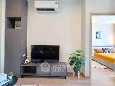 Modern living room with sleek TV stand and air conditioning unit