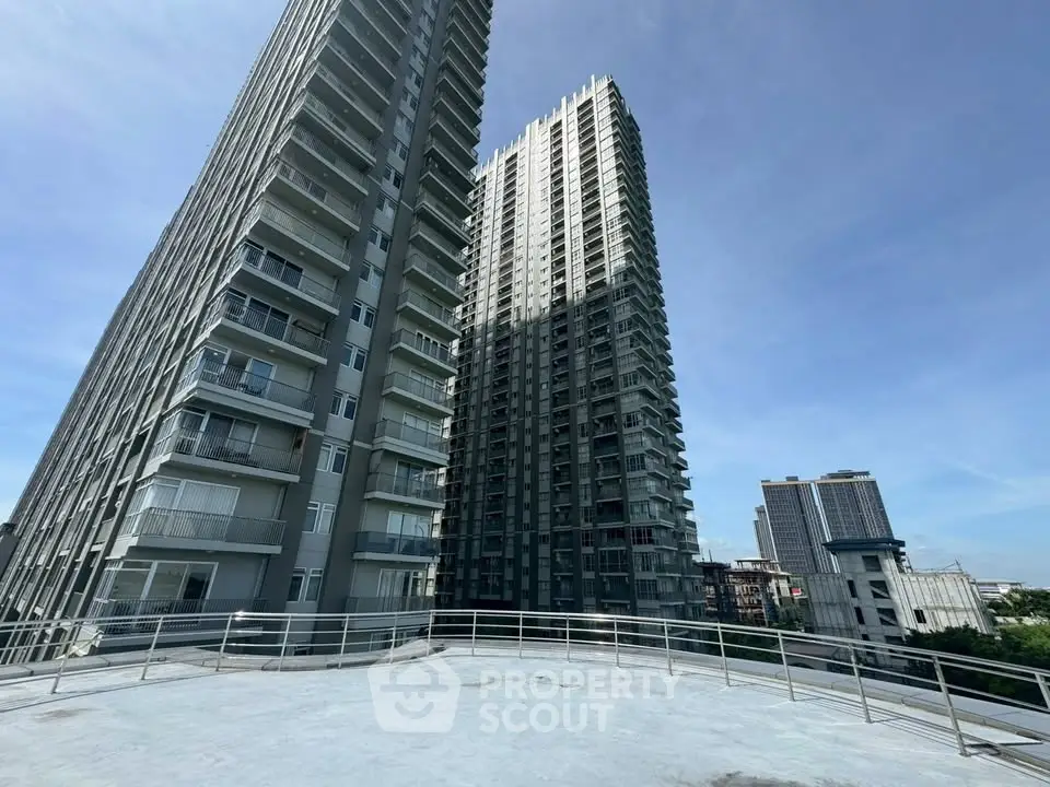 Stunning high-rise residential buildings with modern architecture under a clear blue sky.