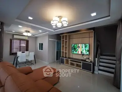 Modern living room with stylish lighting and sleek entertainment unit