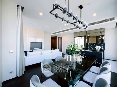 Luxurious modern living room with elegant dining area and stylish chandelier