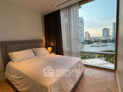 Luxurious bedroom with stunning river view in high-rise apartment